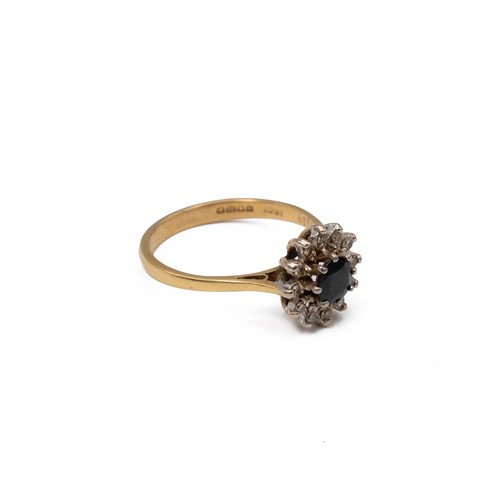 4 - An 18ct gold diamond and sapphire cluster ring in an open claw setting, 3.2 grams, size N 1/2.