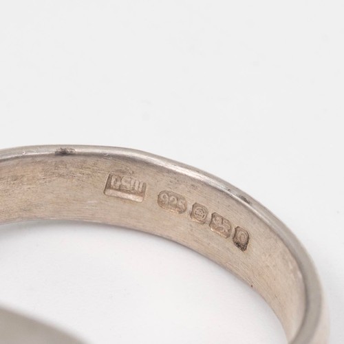 9 - Four vintage rings, to include a silver and agate ring, Birmingham 1971, size L 1/2; a silver and sa... 