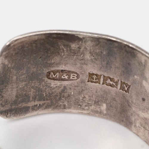 12 - Iluminada Mendes, a silver abstract ring, stamped 'Iluminada, 925', size N; along with a vintage sil... 