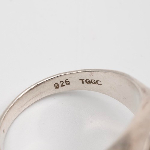 16 - A vintage Jorma Lane Finnish bronze ring, four other rings, and a modern silver moss agate set ring,... 