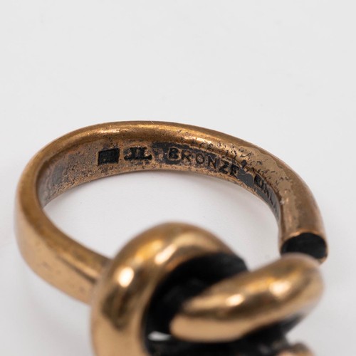 16 - A vintage Jorma Lane Finnish bronze ring, four other rings, and a modern silver moss agate set ring,... 