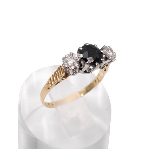 22 - An 18ct gold, sapphire and diamond ring, the two brilliant cut diamonds measuring approximately 0.20... 