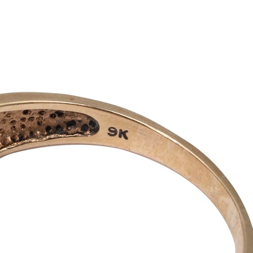 23 - A 9ct gold, white and champagne diamond ring, the centre set with seven square cut champagne coloure... 