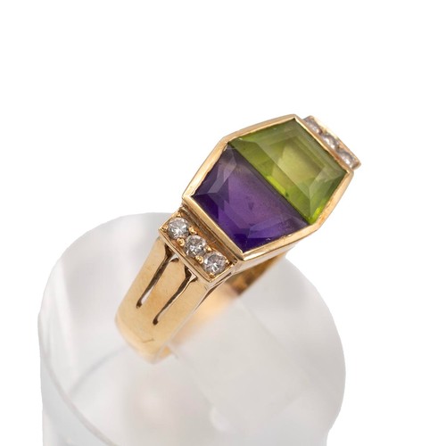 29 - A 14ct gold (tested)Art Deco peridot, amethyst and diamond dress ring in a hexagon shaped mount the ... 