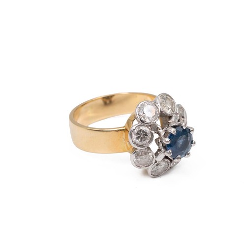 30 - An 18ct gold sapphire and diamond cluster ring, the eight brilliant cut diamonds total measuring app... 