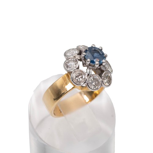 30 - An 18ct gold sapphire and diamond cluster ring, the eight brilliant cut diamonds total measuring app... 