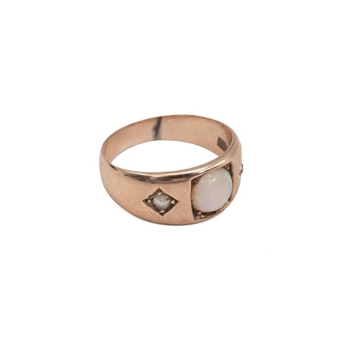 35 - An 18ct gold, diamond and opal ring, set with a single white opal and two old cut diamonds, each in ... 