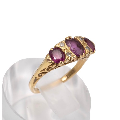 36 - Vintage 18ct gold hallmarked ruby and diamond ring, the centre stone flanked by four diamonds, size ... 