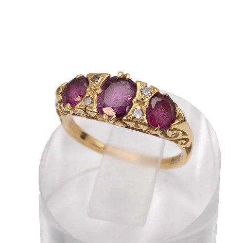 36 - Vintage 18ct gold hallmarked ruby and diamond ring, the centre stone flanked by four diamonds, size ... 