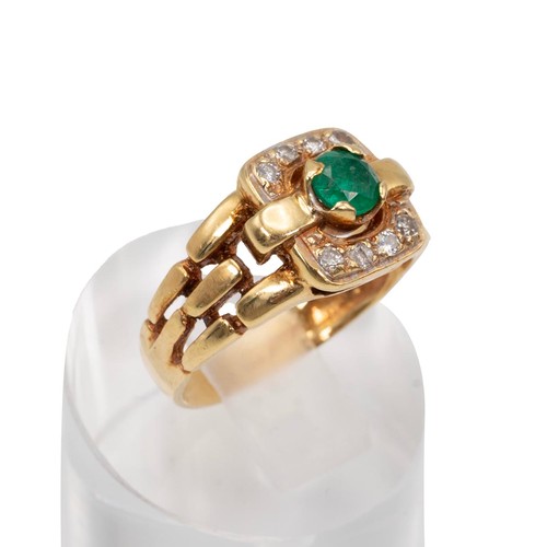 43 - A diamond and emerald ring, the central emerald measuring 5mm x 5mm, in a four claw mount surrounded... 