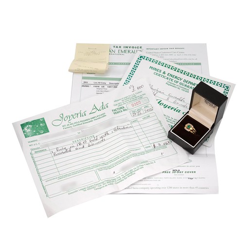 43 - A diamond and emerald ring, the central emerald measuring 5mm x 5mm, in a four claw mount surrounded... 
