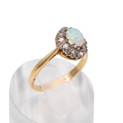 44 - An 18ct gold stamped oval cabochon opal and brilliant cut diamond ring size N, weight 3.0 grams.