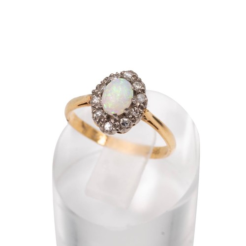 44 - An 18ct gold stamped oval cabochon opal and brilliant cut diamond ring size N, weight 3.0 grams.