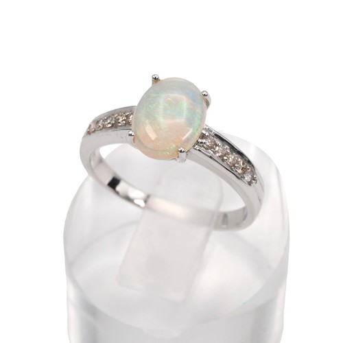 45 - An 18ct white gold opal and diamond ring, the opal set in a four claw setting, set with five brillia... 