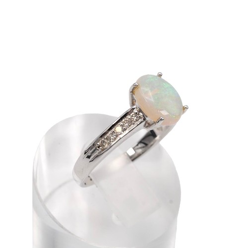 45 - An 18ct white gold opal and diamond ring, the opal set in a four claw setting, set with five brillia... 