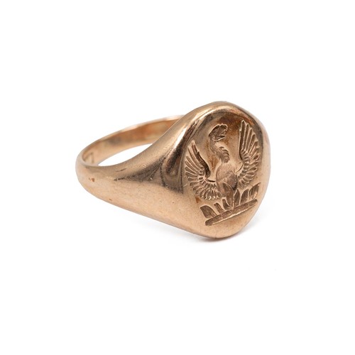 49 - A 9ct gold signet ring, the panel engraved with a phoenix coming from the flames, size N, 5.5 grams ... 