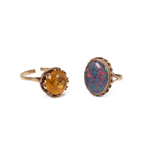 51 - A 9ct hallmarked opal ring of oval form, approx 6ct, size N; and a 9ct gold citrine ring set in a de... 
