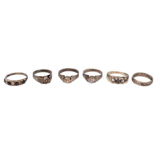 53 - A collection of silver and white metal rings, including an American college-style ring, various size... 