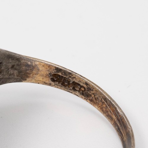 53 - A collection of silver and white metal rings, including an American college-style ring, various size... 
