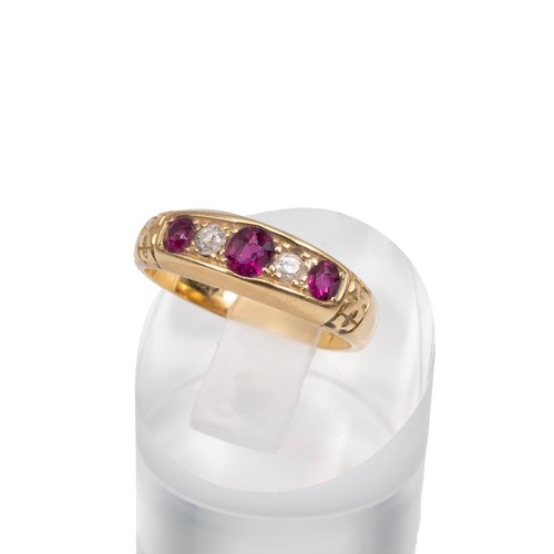 70 - 18ct gold ruby and diamond Gypsy style dress ring, the central ruby flanked by two diamonds and two ... 