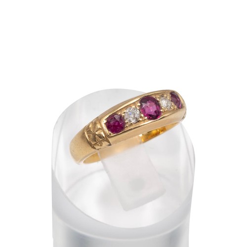 70 - 18ct gold ruby and diamond Gypsy style dress ring, the central ruby flanked by two diamonds and two ... 