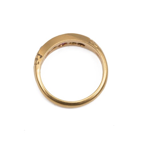 70 - 18ct gold ruby and diamond Gypsy style dress ring, the central ruby flanked by two diamonds and two ... 