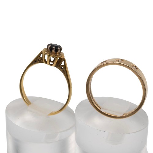 73 - 18ct and 10k gold rings, the 18ct set with a single sapphire in a flower head, size P, weight 2.7 gr... 