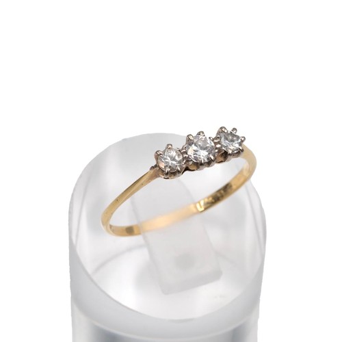 74 - 18ct three stone brilliant cut diamond ring, centre stone approx 0.10ct, flanked by two diamonds app... 