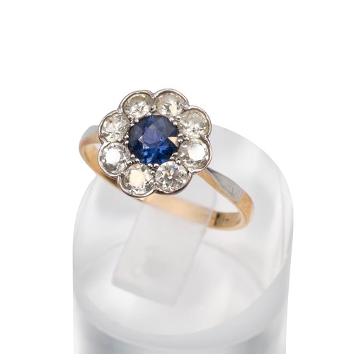 80 - 18ct gold sapphire and diamond ring, central stone, approx 0.5ct surrounded by eight 0.07ct diamonds... 