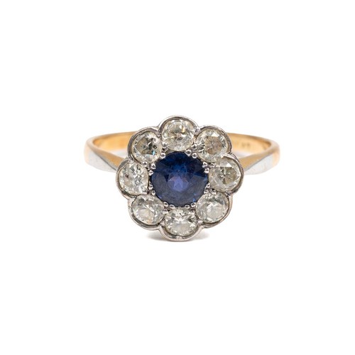 80 - 18ct gold sapphire and diamond ring, central stone, approx 0.5ct surrounded by eight 0.07ct diamonds... 