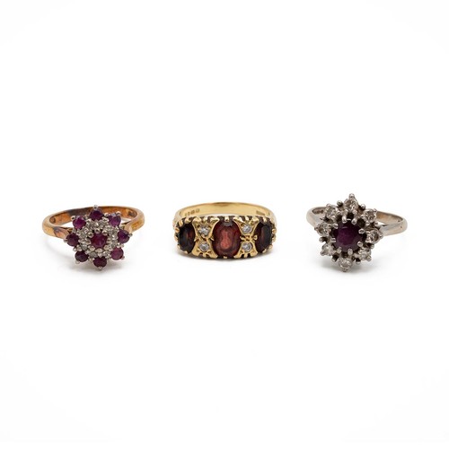 84 - An 18ct gold, diamond and garnet set ring, size N 1/2, along with two other 18ct gold cluster rings,... 