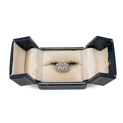 97 - An 18ct gold (tested as 18ct) diamond cluster ring with two central diamonds, each approx 0.33ct, su... 