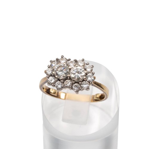 97 - An 18ct gold (tested as 18ct) diamond cluster ring with two central diamonds, each approx 0.33ct, su... 