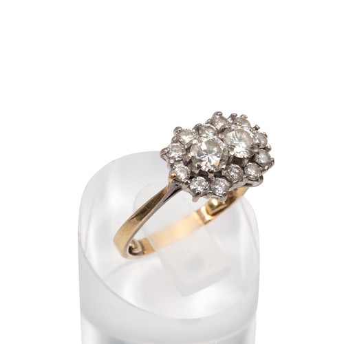 97 - An 18ct gold (tested as 18ct) diamond cluster ring with two central diamonds, each approx 0.33ct, su... 
