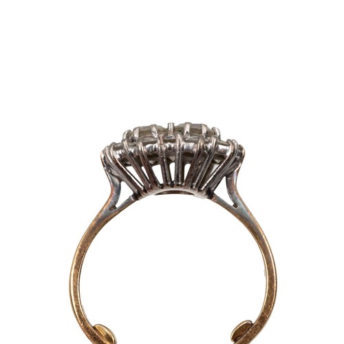 97 - An 18ct gold (tested as 18ct) diamond cluster ring with two central diamonds, each approx 0.33ct, su... 