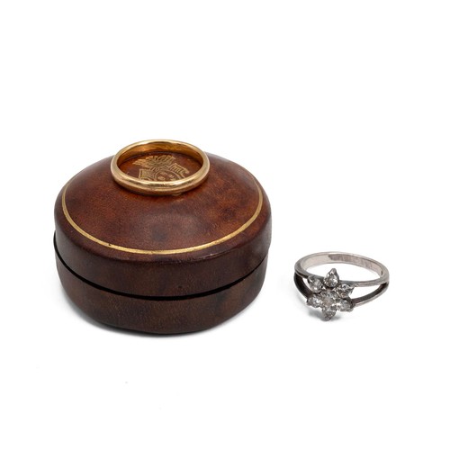 109 - 22ct gold hallmarked wedding band, size P, weight 3.9 grams, and a silver gem-set flower petal ring ... 