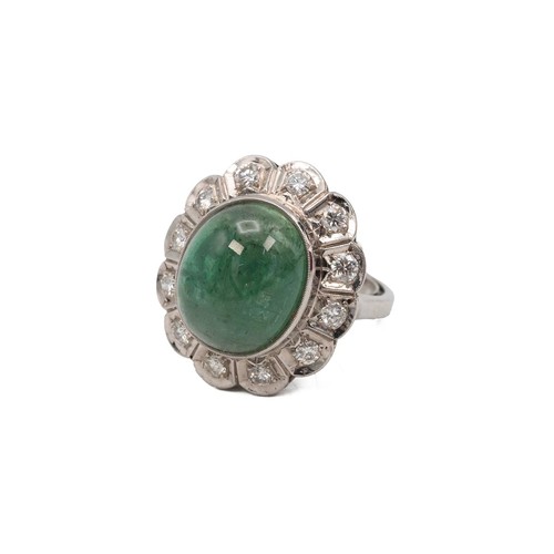 134 - 9ct white gold emerald and diamond ring, the cabochon emerald of oval form approx 1.2cm x 1.5cm, sur... 