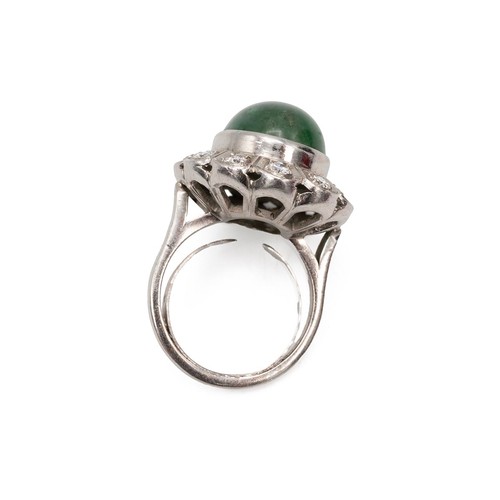 134 - 9ct white gold emerald and diamond ring, the cabochon emerald of oval form approx 1.2cm x 1.5cm, sur... 