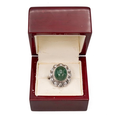 134 - 9ct white gold emerald and diamond ring, the cabochon emerald of oval form approx 1.2cm x 1.5cm, sur... 