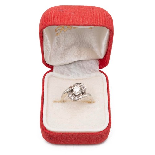 135 - A 14ct gold and diamond twist ring, the central brilliant cut diamond measuring approximately 0.50 c... 