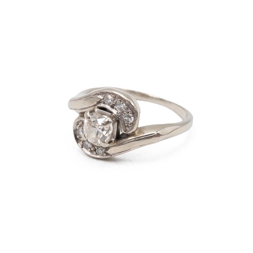 135 - A 14ct gold and diamond twist ring, the central brilliant cut diamond measuring approximately 0.50 c... 