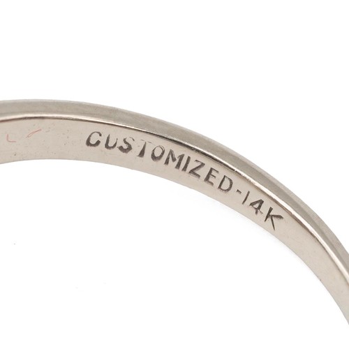 135 - A 14ct gold and diamond twist ring, the central brilliant cut diamond measuring approximately 0.50 c... 