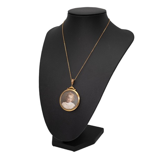 144 - An early 20th-century portrait pendant of a young girl, set in a 9ct gold setting and chain, with a ... 