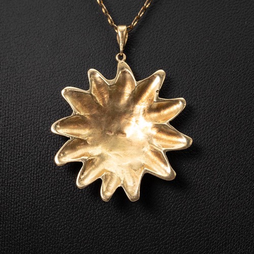 146 - An 18ct gold hallmarked sun face pendant weight 15.3 grams, and a 9ct gold necklace with lobster cla... 