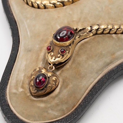 153 - A finely detailed Victorian 15ct gold serpent articulated necklace, set with a garnet cabochon to th... 