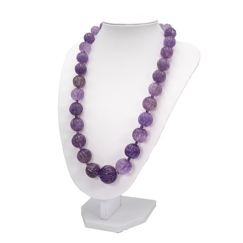 156 - Vintage amethyst ribbed graduating beaded necklace with lobster claws clasp, length 60cm.