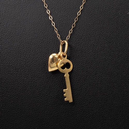 171 - 9ct gold pendant necklace with key and heart pendant, L46cm, weight 1.3 grams.