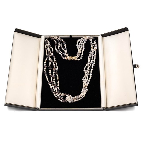 180 - A four strand fresh water pearl necklace with 18ct and diamond clasp the pearls with intermittent go... 