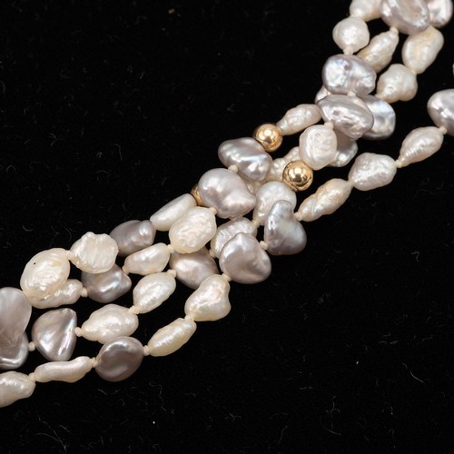 180 - A four strand fresh water pearl necklace with 18ct and diamond clasp the pearls with intermittent go... 