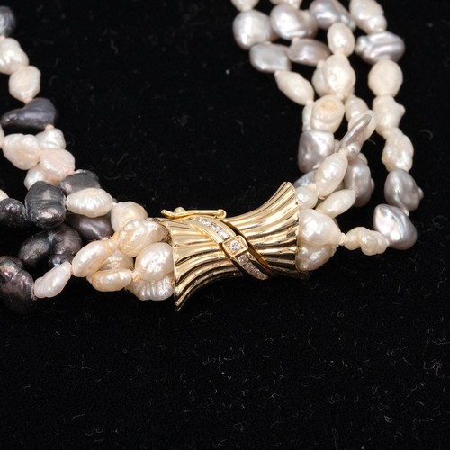 180 - A four strand fresh water pearl necklace with 18ct and diamond clasp the pearls with intermittent go... 